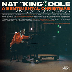 the album cover for Nat King Cole - A Sentimental Christmas With Nat King Cole And Friends: Cole Classics Reimagined