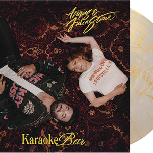 the album cover for Angus & Julia Stone - Karaoke Bar [Indie Exclusive Gold/Clear Smoky Marble]