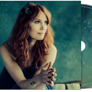 the album cover for Alicia Witt - Between Heaven and Earth